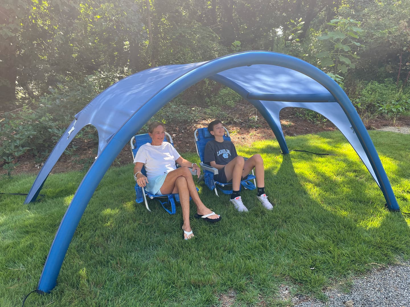 Shady Baby canopy set up in a backyard near a pool